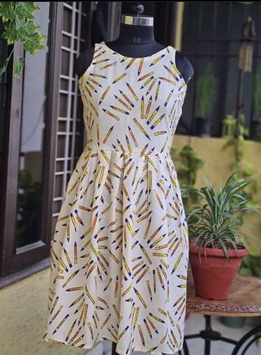 Clothing,Day dress,Dress,Yellow,One-piece garment,Fashion,Pattern,Shoulder,Pattern,Cocktail dress