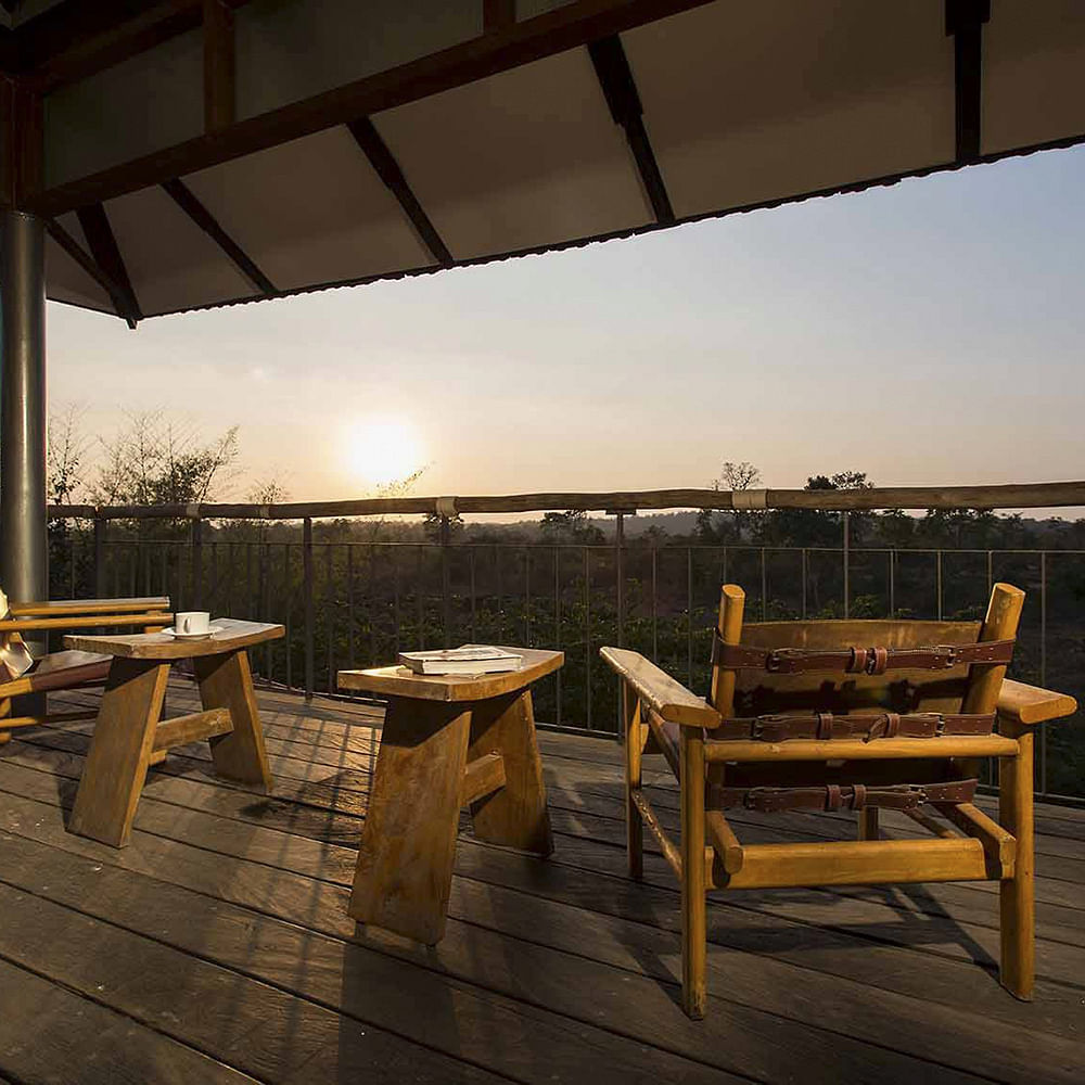 Sky,Table,Furniture,Cloud,Chair,Atmosphere,Room,Restaurant,Roof,House