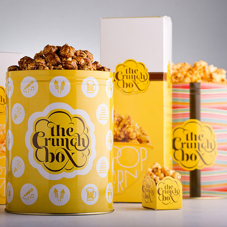 Popcorn,Kettle corn,Snack,Caramel corn,Food,Yellow,Font,Cuisine,Vegetarian food,Paper bag