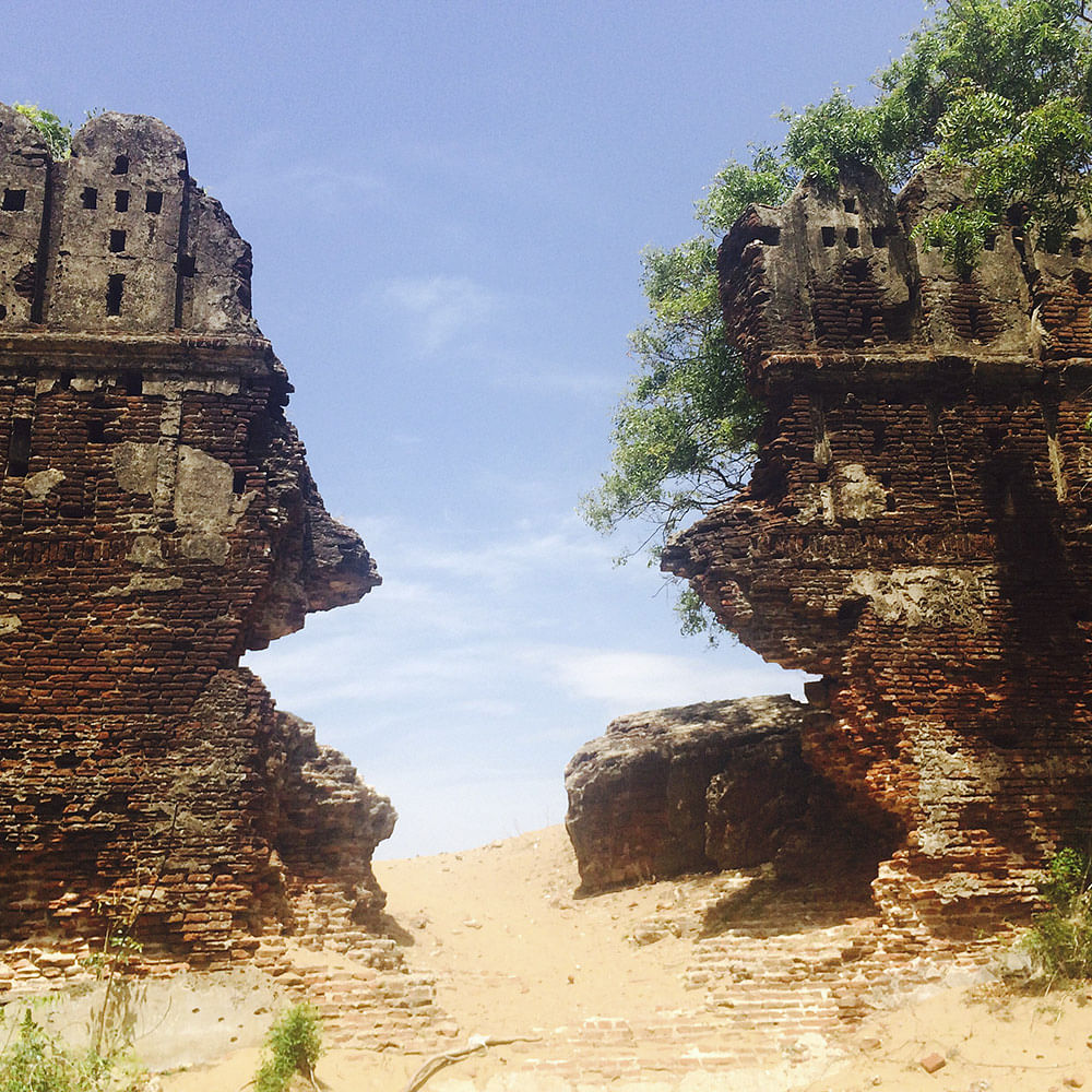 Rock,Formation,Natural landscape,Outcrop,Geology,Sky,Ruins,Historic site,Cliff,Tree