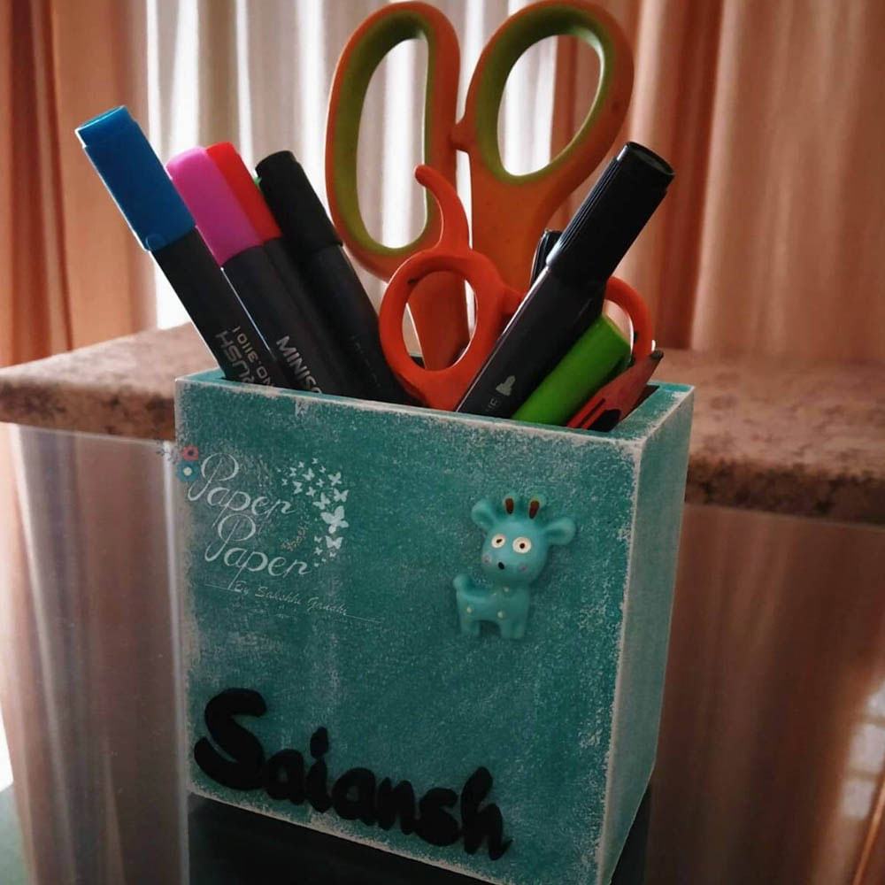 Green,Blue,Turquoise,Pink,Pencil,Office supplies,Writing implement,Material property,Hand,Pencil case