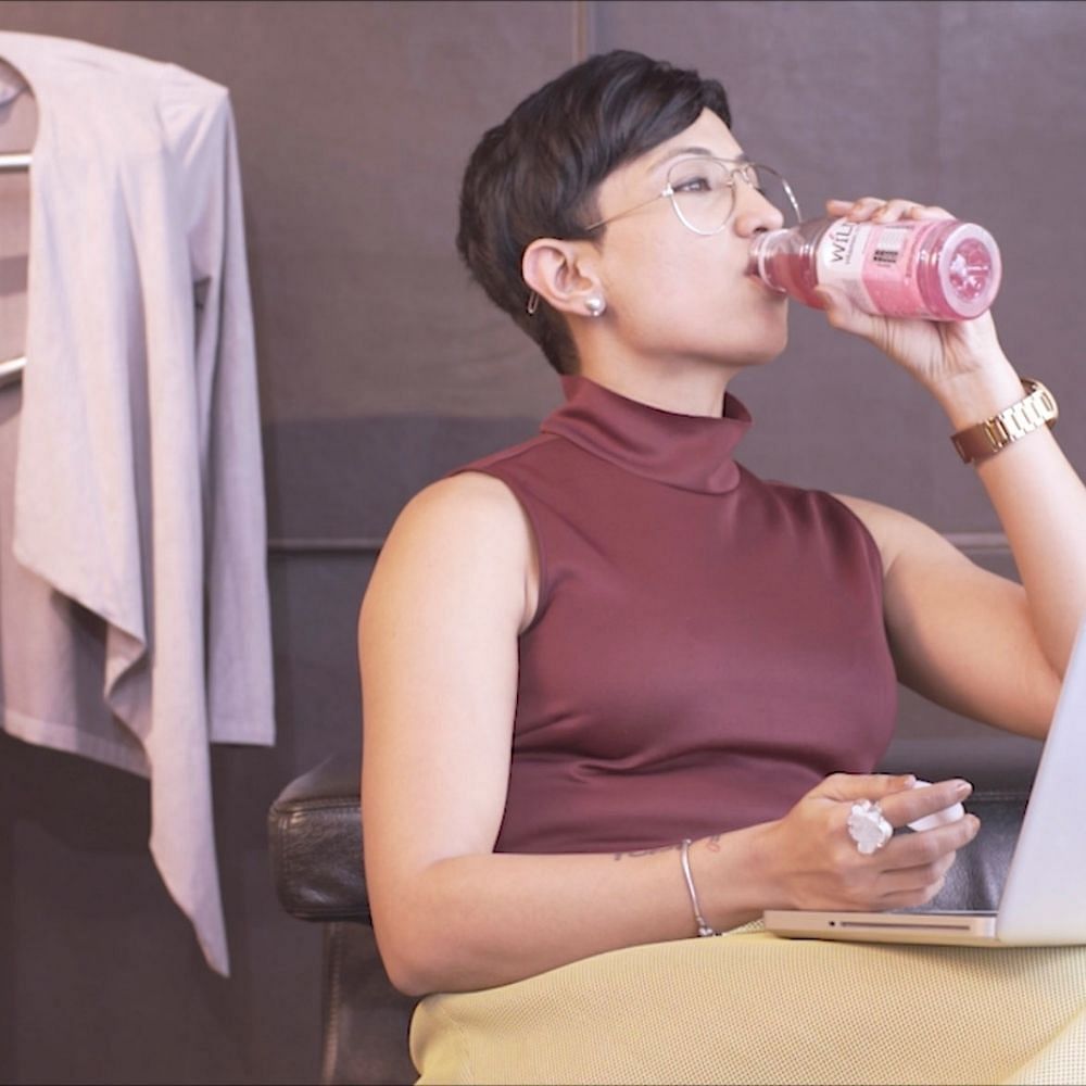 Skin,Neck,Beauty,Pink,Shoulder,Arm,Ear,Drinking,Muscle,Top