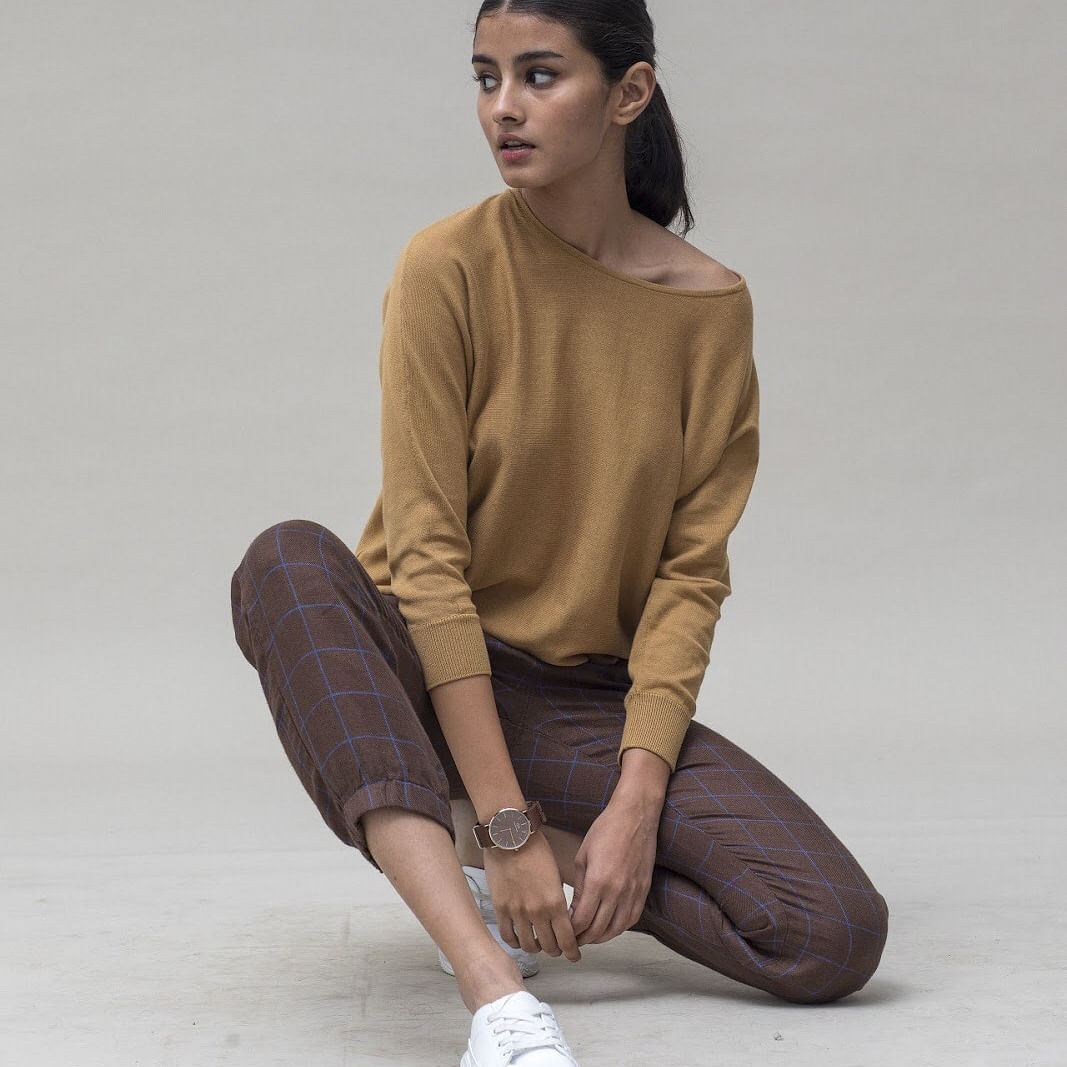 Clothing,Sitting,Sleeve,Footwear,Neck,Sportswear,Shoulder,Outerwear,Shoe,Beige