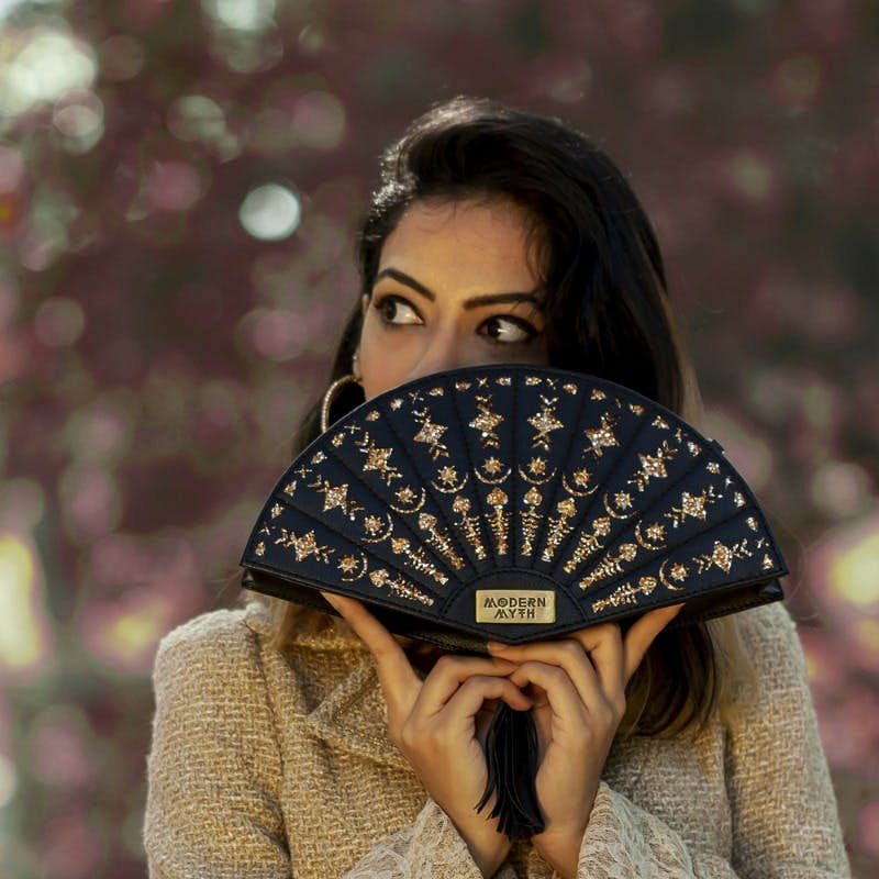 Beauty,Hand fan,Headgear,Fashion accessory,Photography,Beanie,Outerwear,Brown hair,Bandana,Street fashion