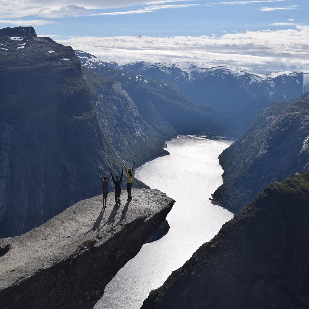 Mountainous landforms,Mountain,Fjord,Highland,Natural landscape,Glacial landform,Mountain range,Sound,Sky,Water