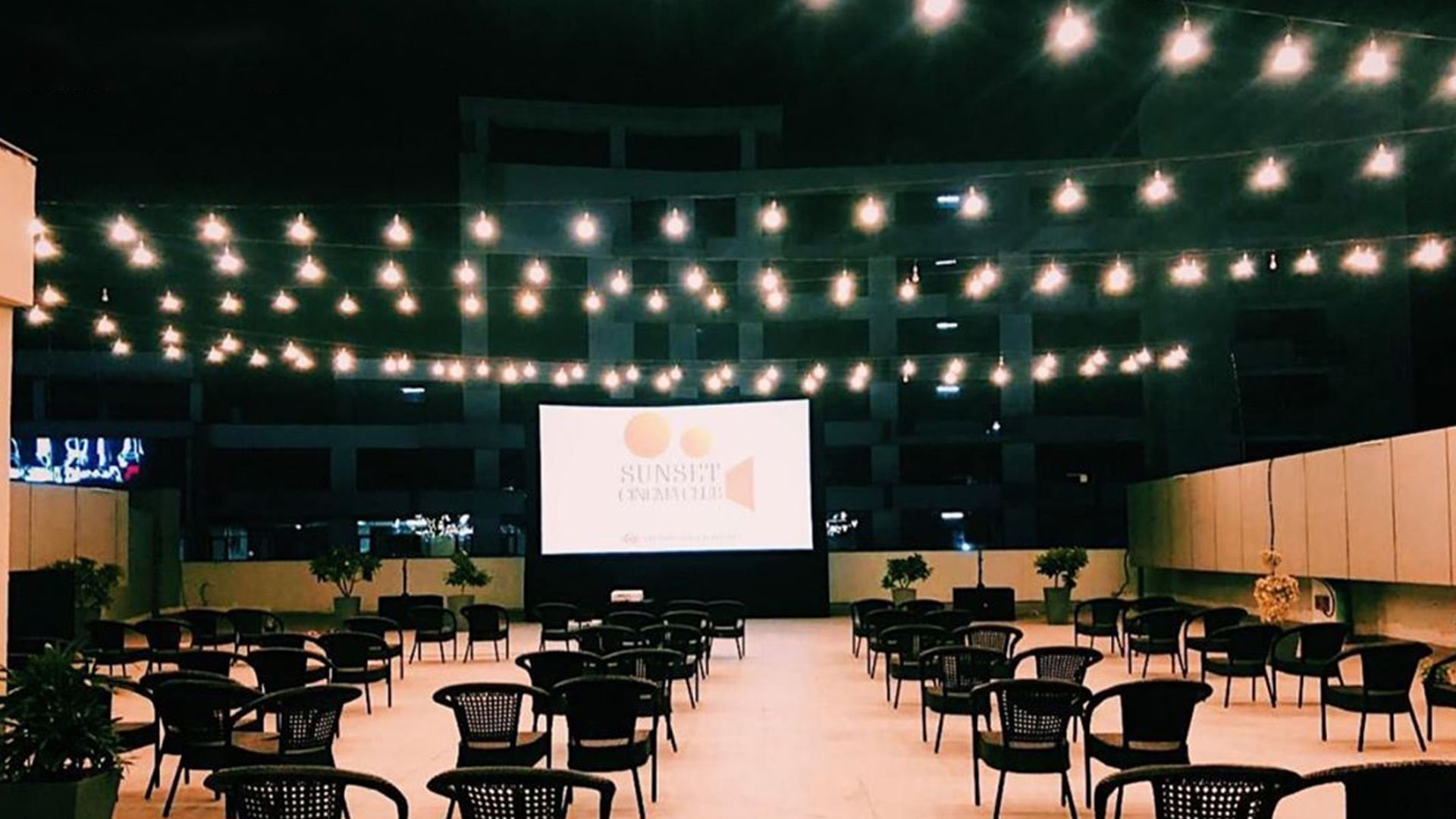 Projection screen,Auditorium,Stage,Projector accessory,Building,Convention,Function hall,Event,Technology,Architecture