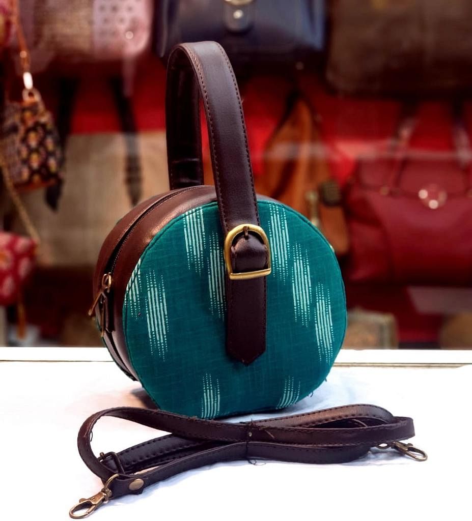 Turquoise,Audio equipment,Teal,Headphones,Handbag,Fashion accessory,Leather,Technology,Bag,Gadget