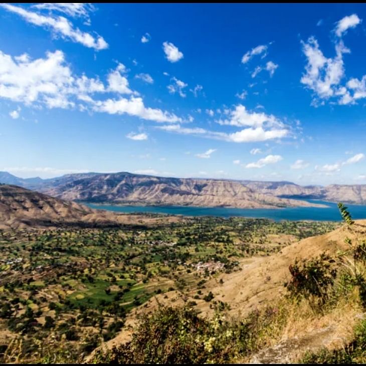 Mountainous landforms,Sky,Mountain,Natural landscape,Nature,Wilderness,Vegetation,Cloud,Highland,Mountain range