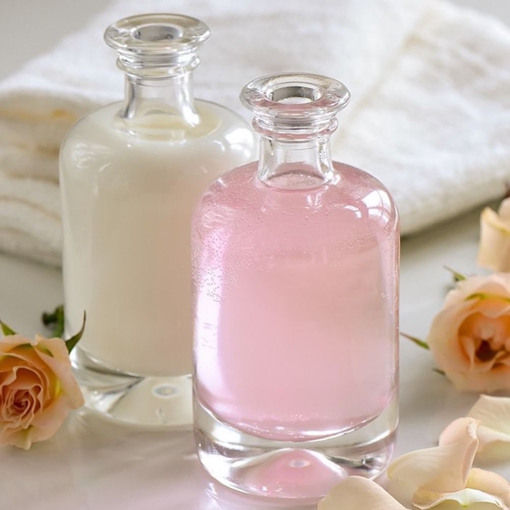 Glass bottle,Pink,Bottle,Rose,Petal,Glass,Flower,Rose water,Drink,Plant