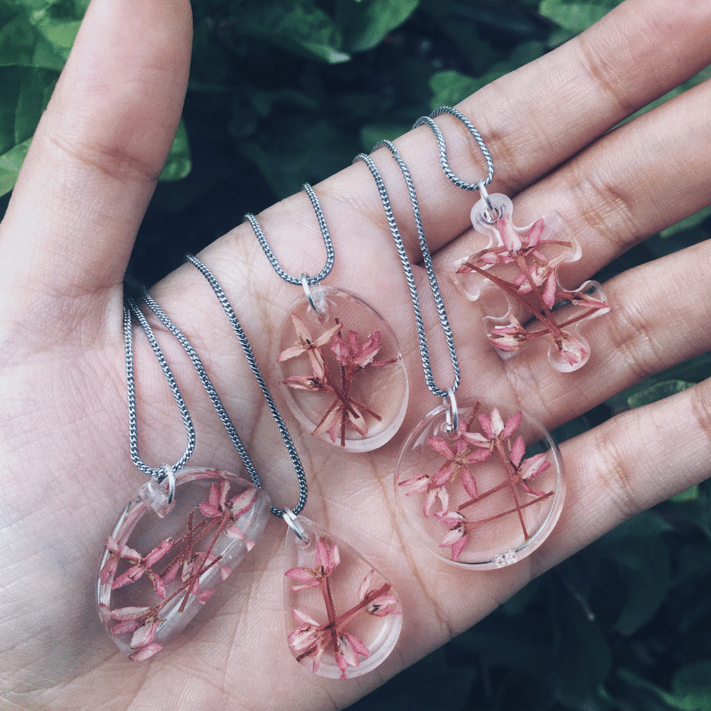 Pink,Body jewelry,Hand,Jewellery,Fashion accessory,Finger,Nail,Chain,Plant,Magenta