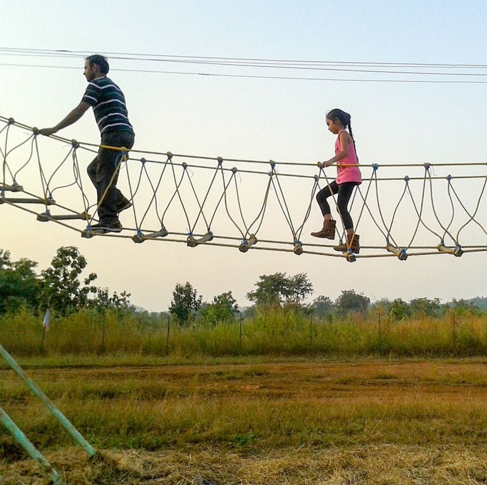 Sky,Fun,Tree,Bridge,Recreation,Leisure,Nonbuilding structure,Rope bridge