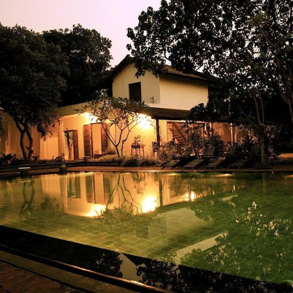 Reflection,Property,Tree,Residential area,Real estate,Landscape,House,Home,Swimming pool,Resort