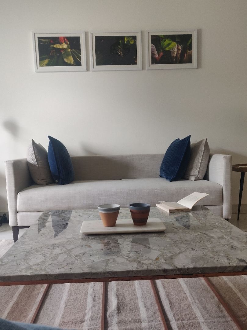 Furniture,Room,Living room,Table,Property,Couch,Floor,Coffee table,Interior design,studio couch