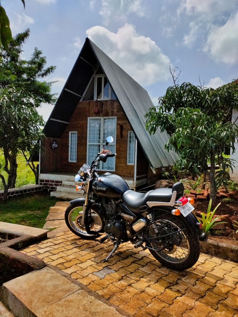 Motorcycle,Vehicle,House,Tree,Car,Architecture,Automotive tire,Auto part,Landscape,Motorcycling