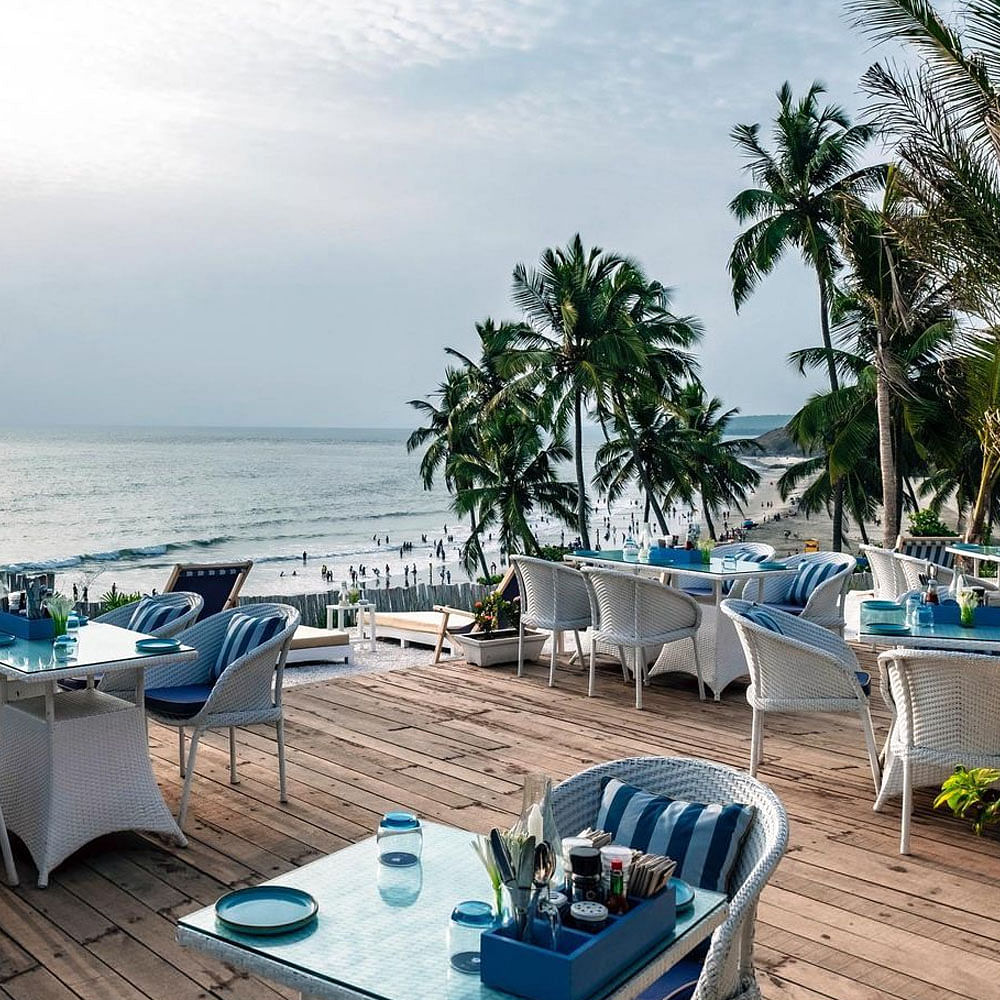 Outdoor furniture,Furniture,Coastal and oceanic landforms,Resort,Table,Ocean,Turquoise,Teal,Beach,Azure