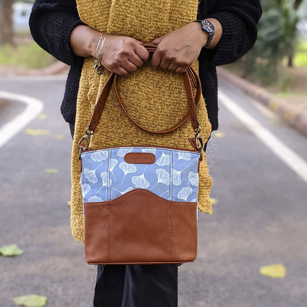 Clothing,Brown,Bag,Textile,Joint,Asphalt,Pattern,Street fashion,Road surface,Denim