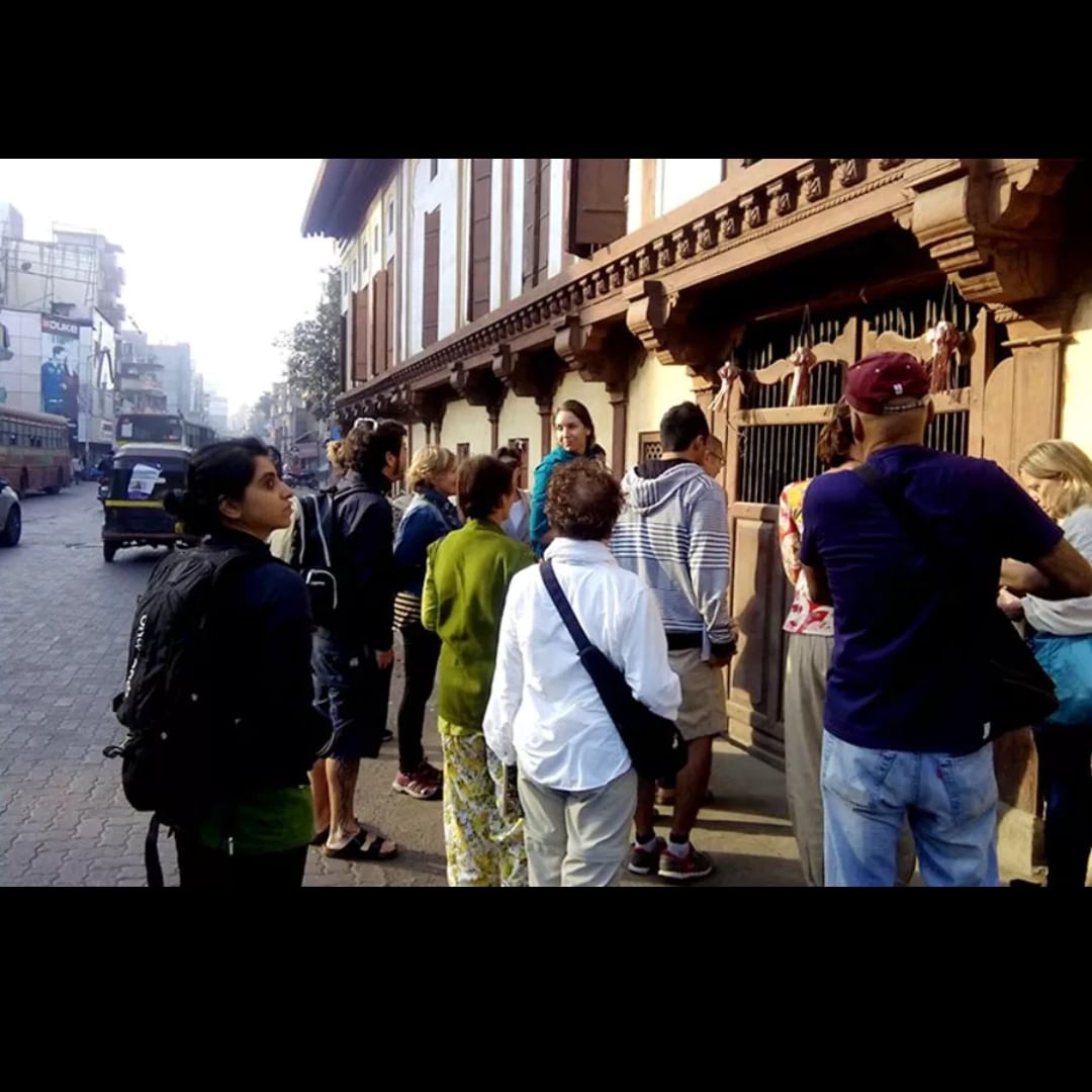 Building,Street fashion,Travel,Cool,Neighbourhood,T-shirt,Road,City,Tints and shades,Asphalt