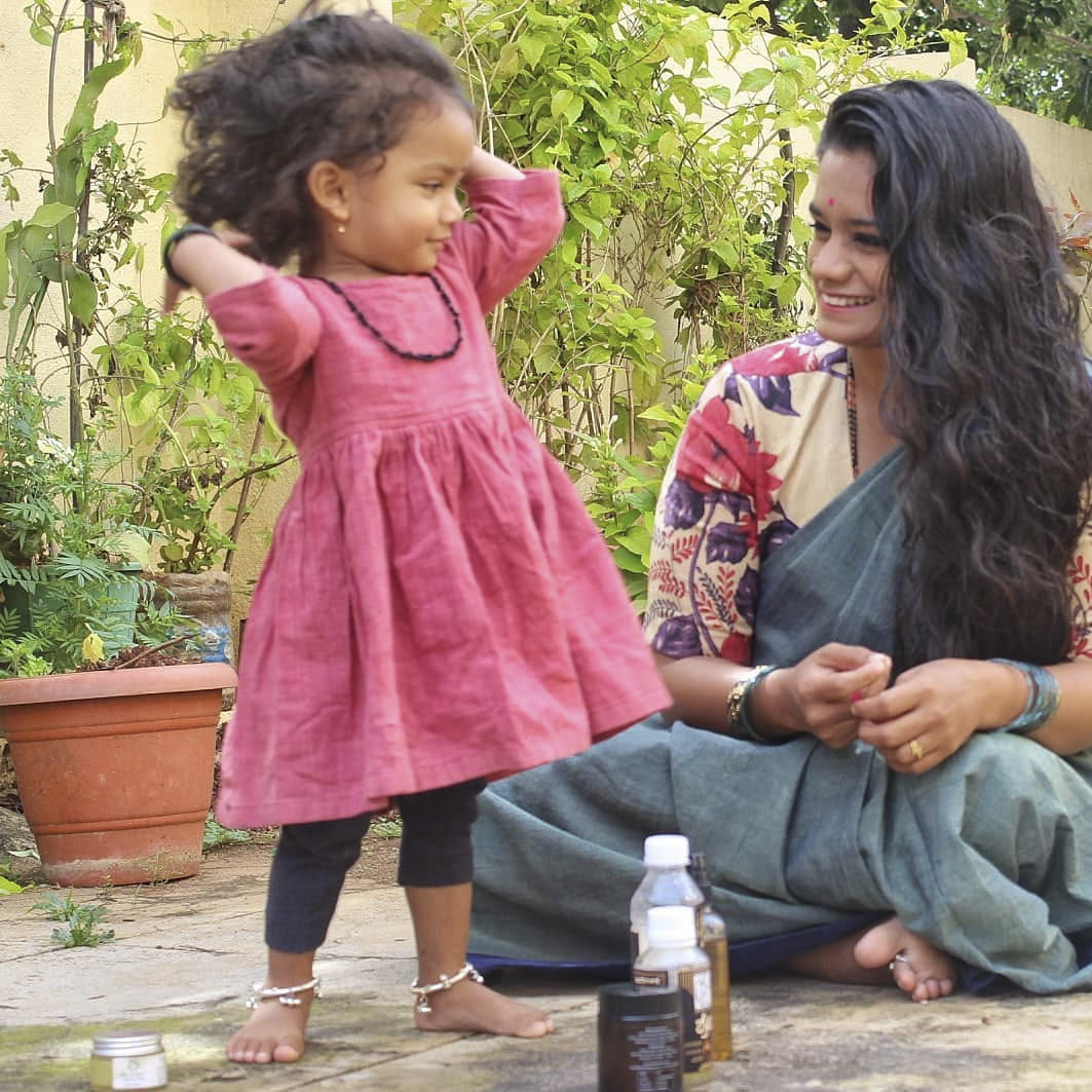 Hair,Joint,Skin,Head,Plant,Arm,Photograph,Facial expression,Smile,Flowerpot