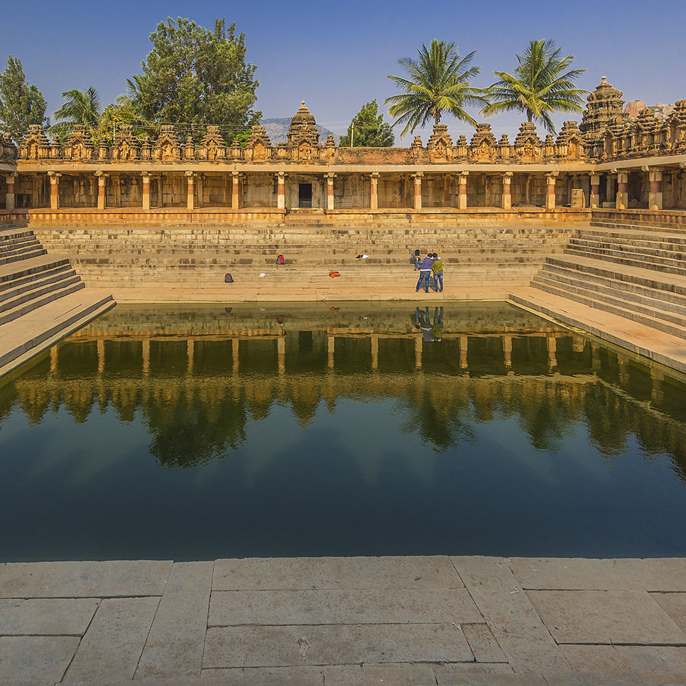 Water,Sky,Daytime,Tree,Leisure,Landscape,Plant,Symmetry,Reflection,Palm tree