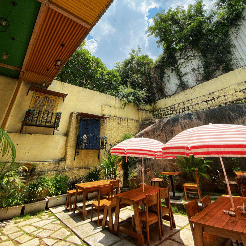 Table,Furniture,Plant,Property,Sky,Green,Umbrella,Building,Cloud,Shade