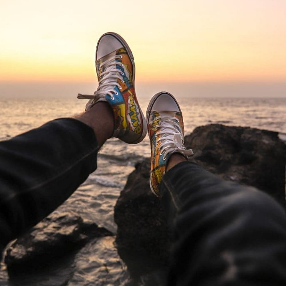 Water,Shoe,Sky,People in nature,Leg,Cloud,Sunlight,Body of water,Walking shoe,Sneakers