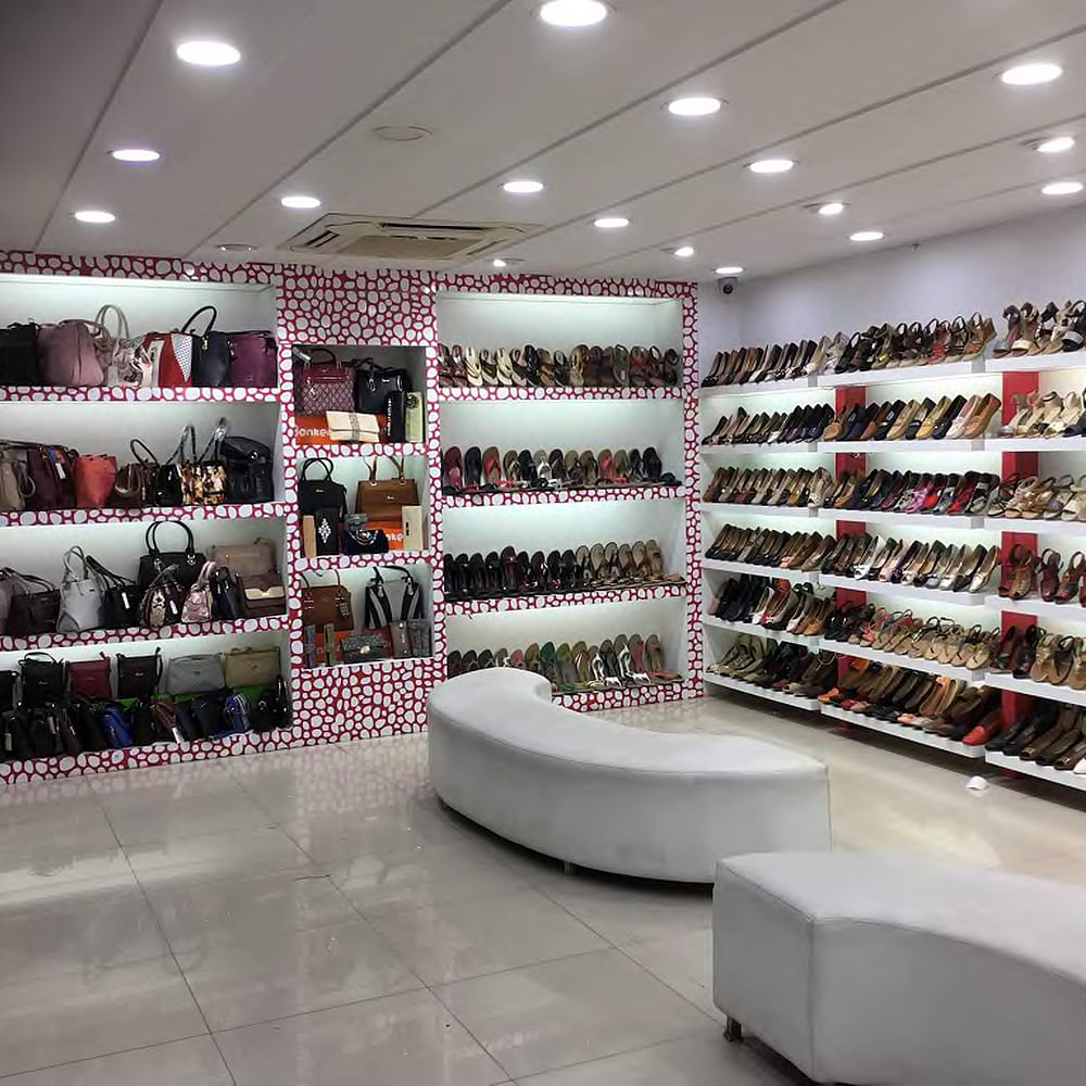 Footwear,Shoe,Shelf,Furniture,Automotive design,Shelving,Interior design,Shoe store,Building,Eyewear