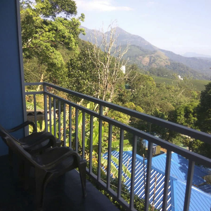 Sky,Plant,Property,Cloud,Fence,Tree,Mountain,Sunlight,Vegetation,Porch