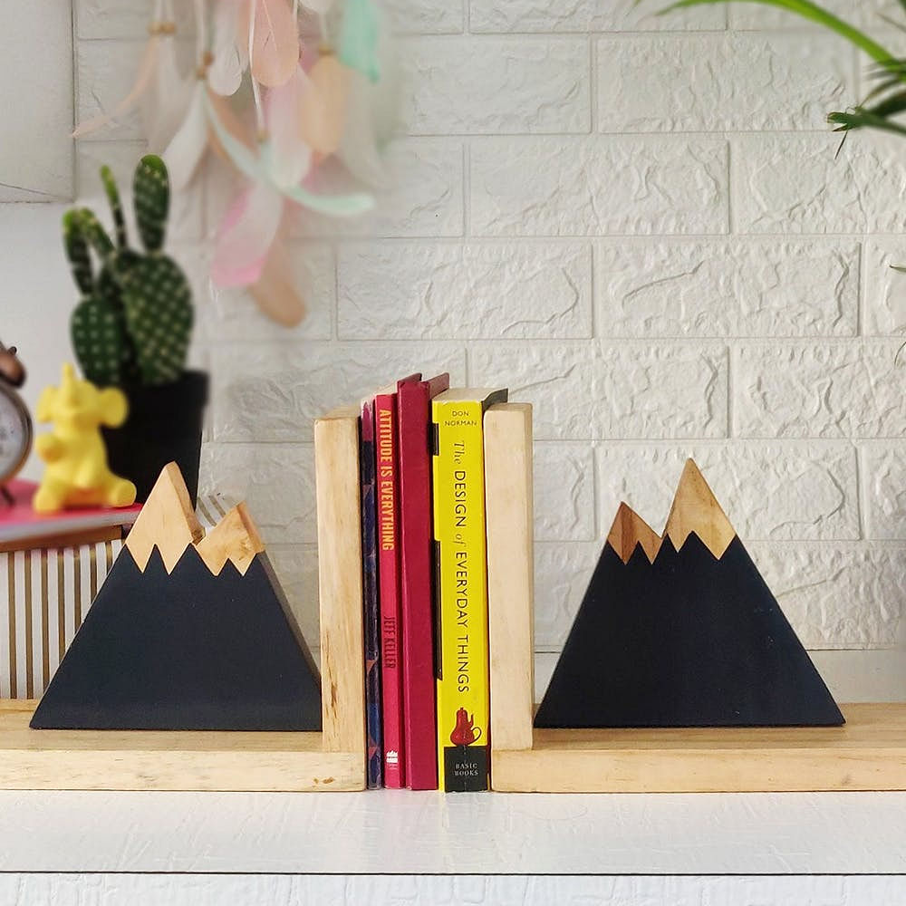 Wood,Textile,Book,Rectangle,Interior design,Publication,Yellow,Shelving,Plant,Wall