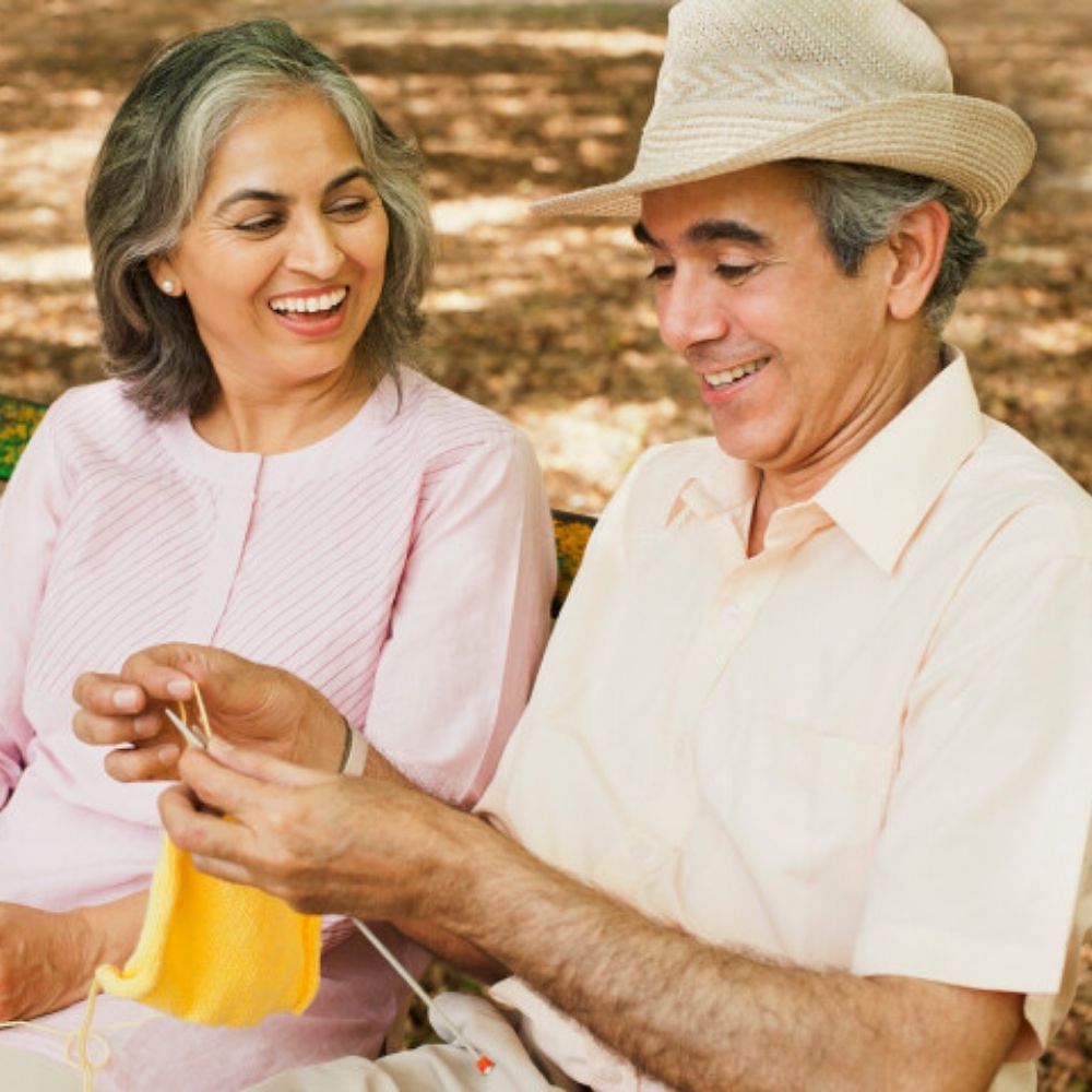 Smile,Hat,People in nature,Happy,Mammal,Gesture,Yellow,Leisure,Fun,Family taking photos together