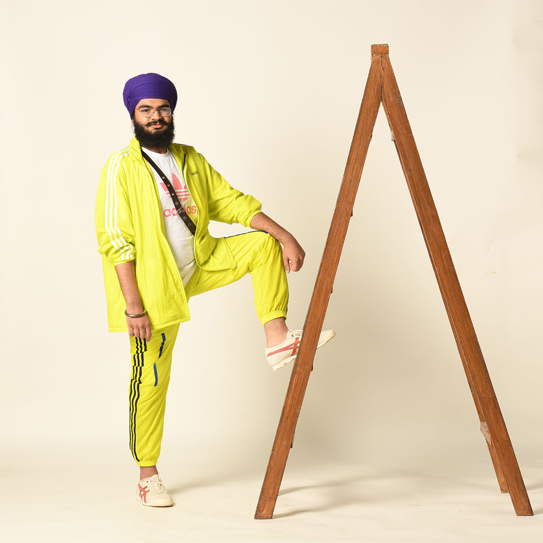 Sleeve,Triangle,Hat,Art,Fashion design,Toy,Street fashion,Workwear,Sitting,Personal protective equipment