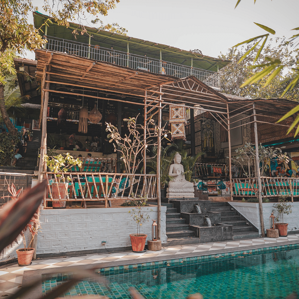 Water,Sky,Botany,Temple,Shade,Leisure,Tree,Swimming pool,Chinese architecture,Building