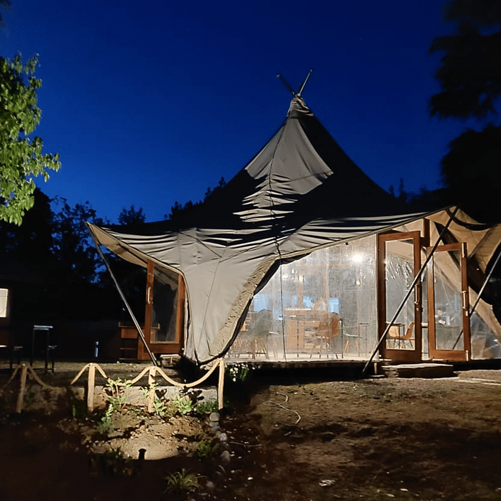 Sky,Plant,Building,Tent,Shade,Tree,House,Landscape,Gazebo,Leisure