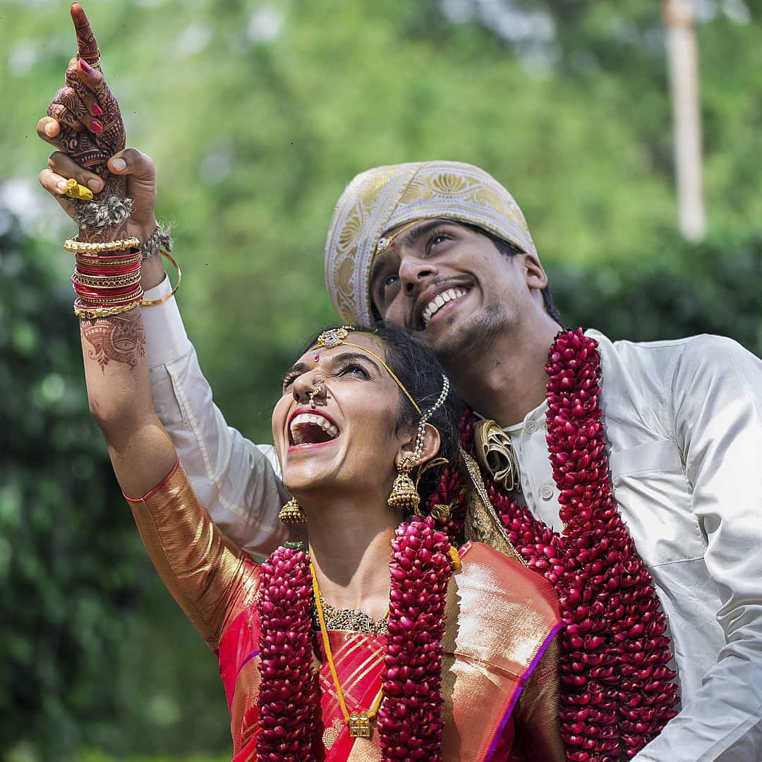 Smile,Hand,Hairstyle,Happy,Gesture,Entertainment,Performing arts,Fun,People in nature,Necklace