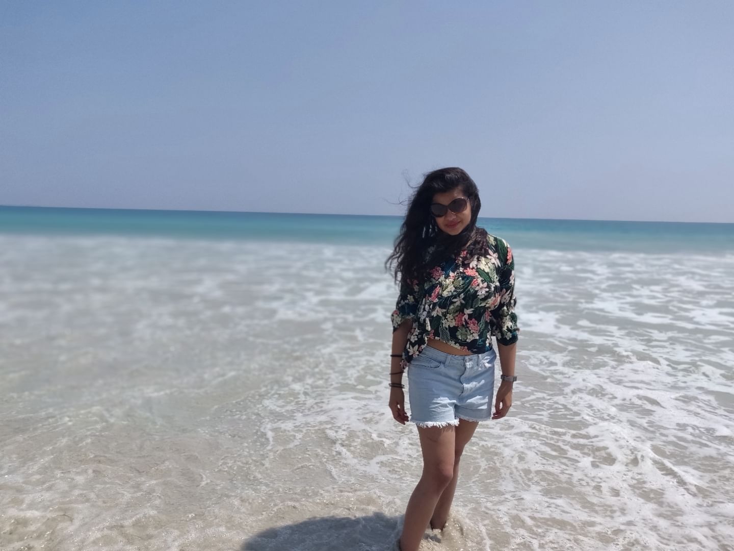 Clothing,Water,Sky,Azure,Flash photography,Beach,Happy,Coastal and oceanic landforms,Shorts,Street fashion