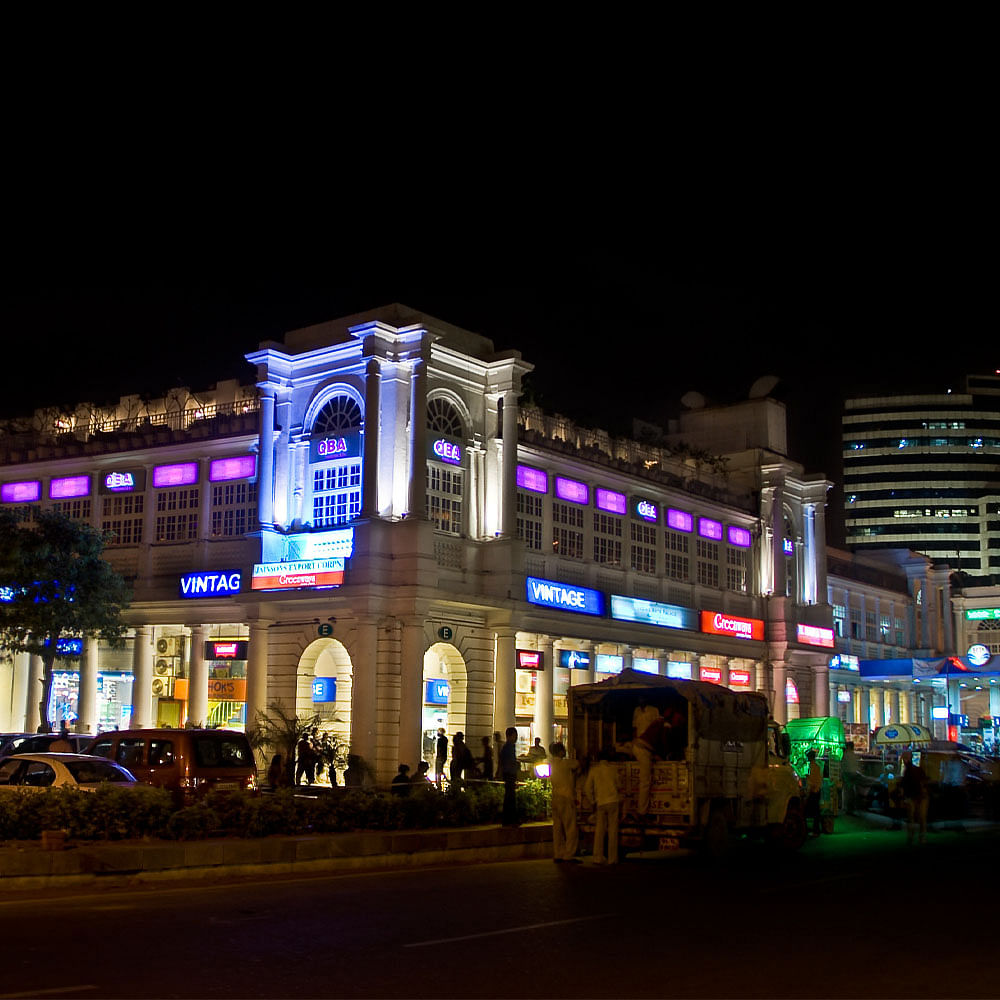 Building,Electricity,Automotive lighting,Wheel,Window,Electronic signage,Facade,Midnight,City,Neon