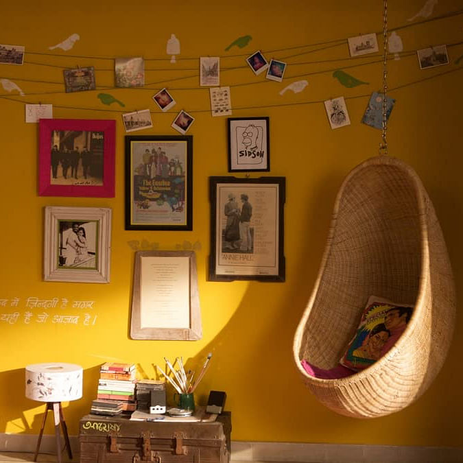 Picture frame,Furniture,Building,Table,Interior design,Lighting,Orange,Plant,Lamp,Wall