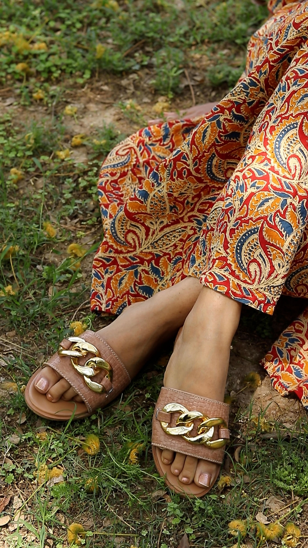 Joint,Shoe,People in nature,Sleeve,Street fashion,Grass,Yellow,Finger,One-piece garment,Adaptation