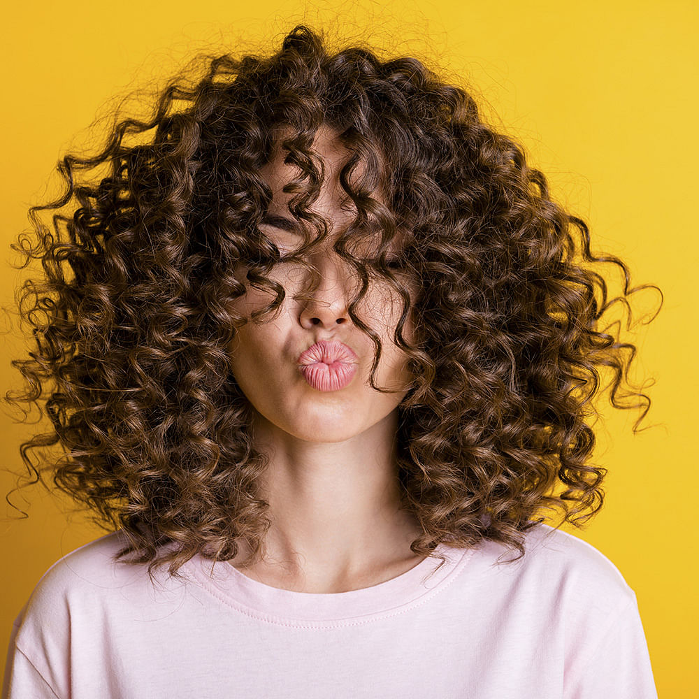 Forehead,Hair,Chin,Jheri curl,Hairstyle,Eyebrow,Ringlet,Black,Neck,Jaw