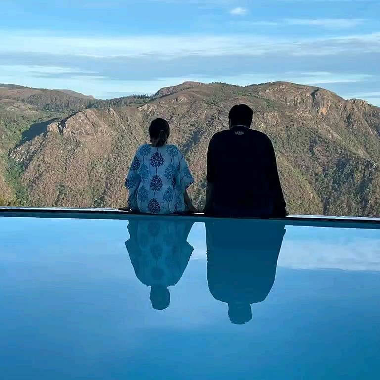 Cloud,Sky,Water,Water resources,Mountain,Azure,Natural landscape,People in nature,Happy,Gesture