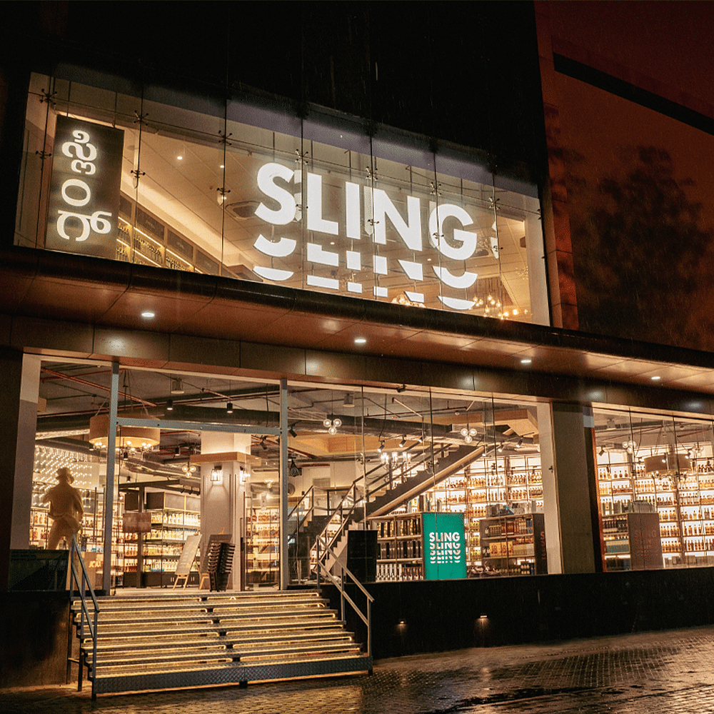 Building,Font,Sky,Facade,City,Urban area,Signage,Mixed-use,Metal,Midnight