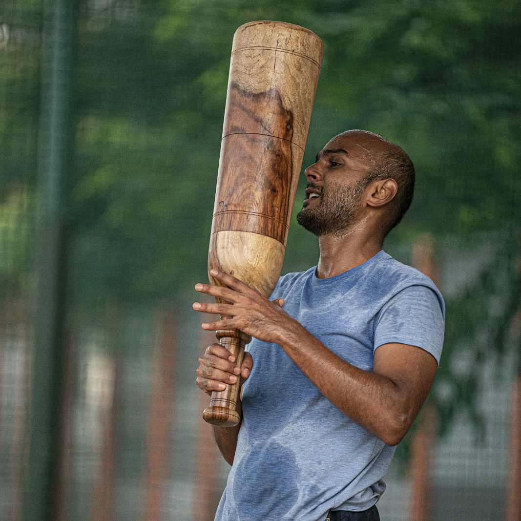 Hand,Baseball bat,Arm,Axe,Wood,Glove,Elbow,Baseball equipment,Artifact,Splitting maul