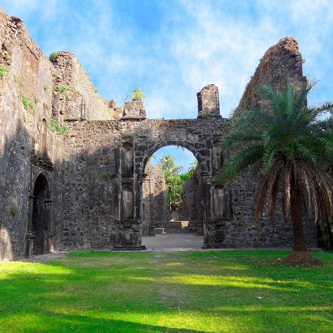 Cloud,Sky,Green,Plant,Tree,Grass,Natural landscape,Landscape,Archaeological site,Arch