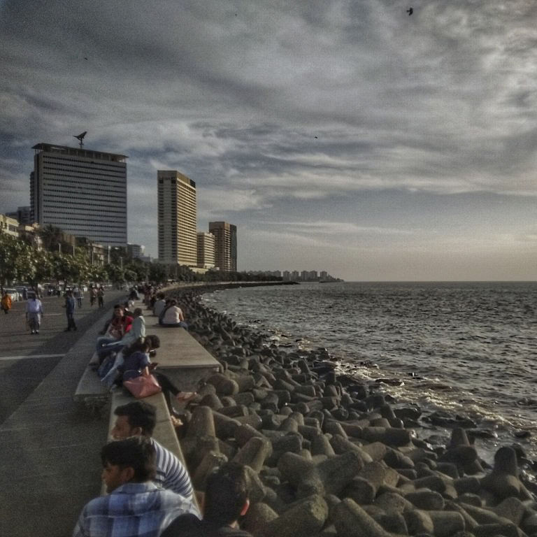 Cloud,Sky,Water,Building,Coastal and oceanic landforms,Beach,Dusk,Tower block,Horizon,City