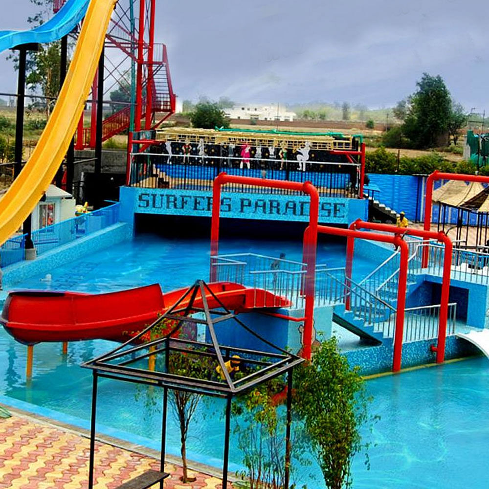 Water,Sky,Tree,Cloud,Wheel,Public space,Vehicle,Leisure,Chute,Recreation