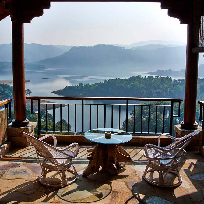 Sky,Water,Property,Furniture,Building,Table,Azure,Wood,Chair,Mountain