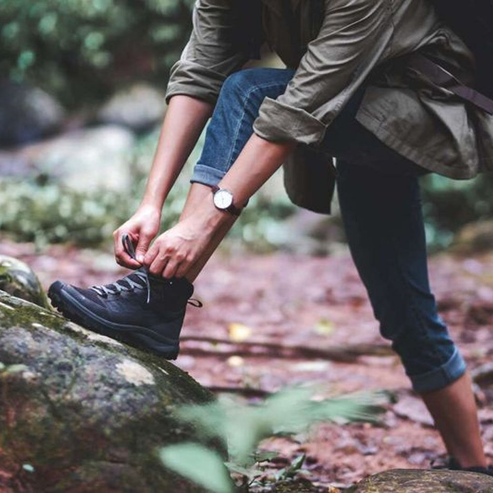 Shoe,People in nature,Leg,Plant,Gesture,Thigh,Wood,Sneakers,Grass,Knee