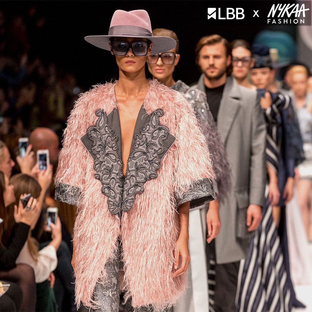 Hairstyle,Fashion,Vision care,Hat,Eyewear,Waist,Fedora,Sun hat,Runway,Fashion design