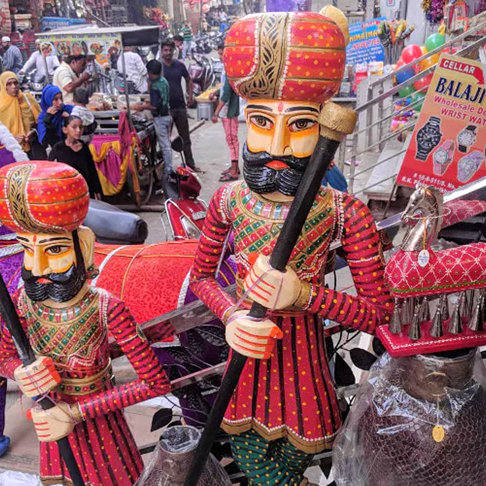 Temple,Dress,Headgear,Market,Public space,City,Event,Tradition,Human settlement,Pattern