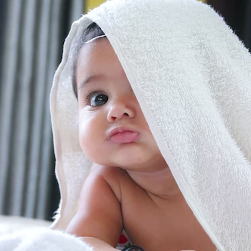 Face,Eyebrow,Happy,Comfort,Toddler,Smile,Linens,Cap,Eyelash,Baby