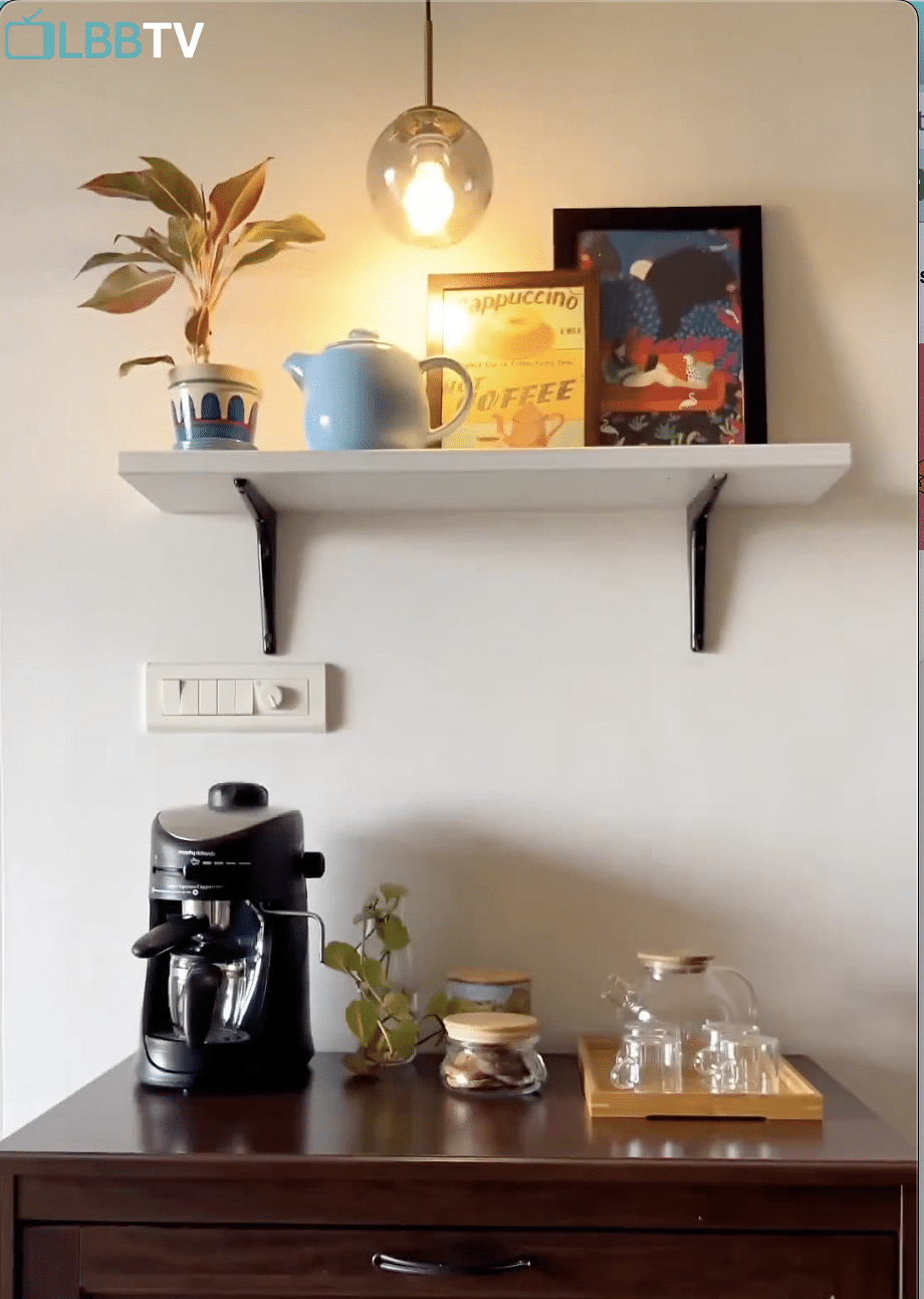 Shelf,Shelving,Orange,Lighting,Plant,Interior design,Yellow,Wall,Wood,Houseplant